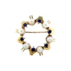 Clearance Gouden broche met saffier en parel 14 krt Broches