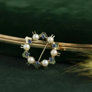 Clearance Gouden broche met saffier en parel 14 krt Broches