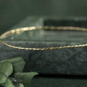 Hot Gouden getordeerde rinkelarmband 14 krt Bangles